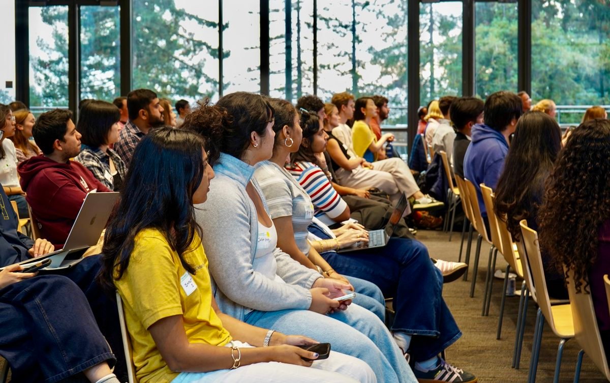 Rows of attendees listening closely during the talks