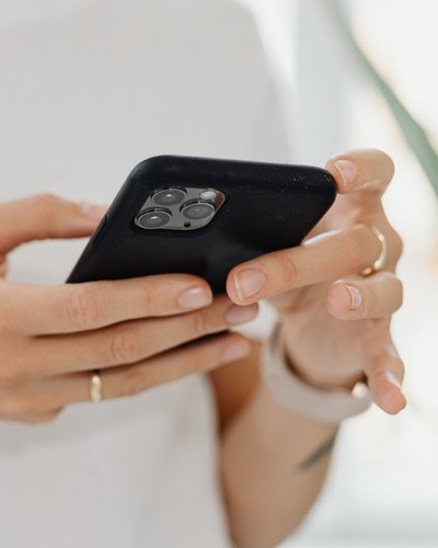 Close-up of hands holding a smartphone